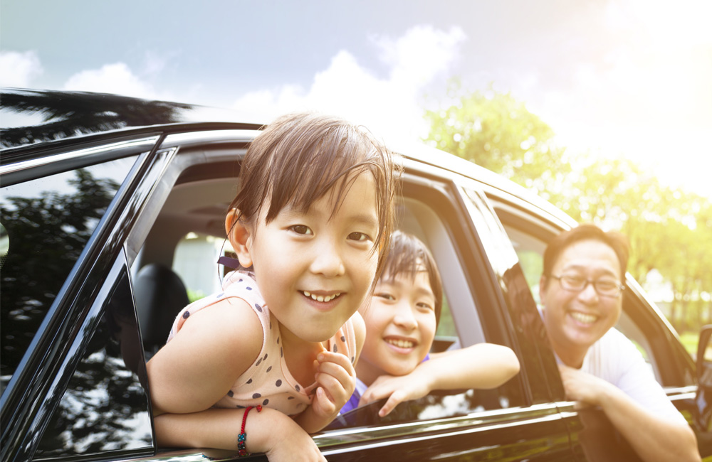 Happy family smiling in the car