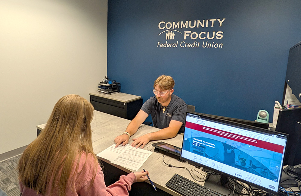 Financial representative reviewing documents with a customer