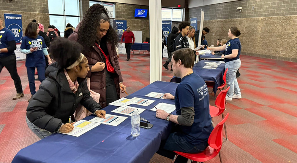 Community Focus FCU team facilitating a budgeting workshop at the Ecorse High school