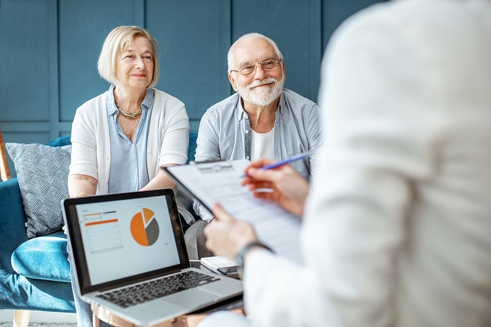 Older couple meeting with a financial advisor