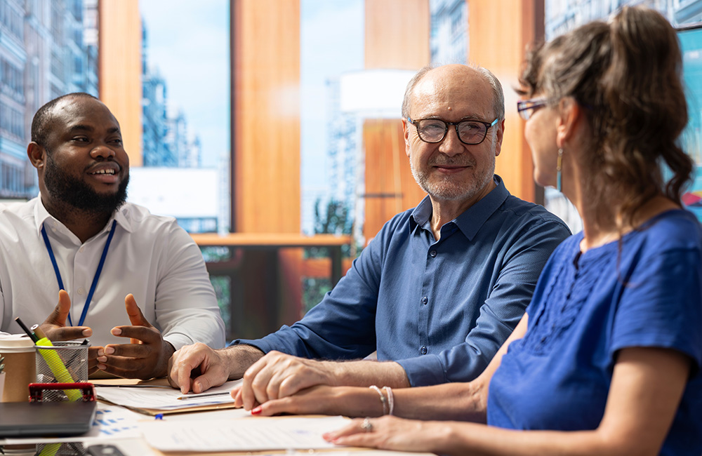 Financial representative meeting with two clients
