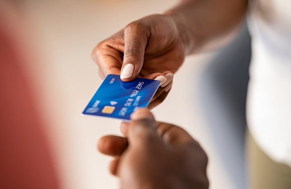 Business owner accepting a card payment on a mobile card reader