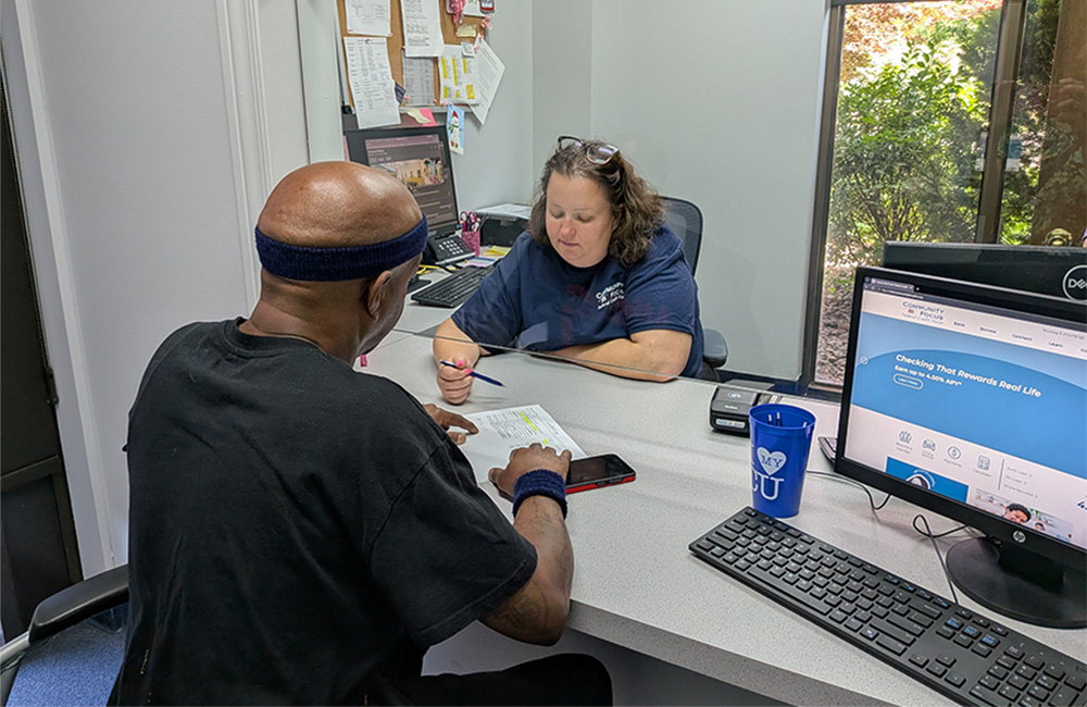 Member Service Representative assisting a member at the Community Focus FCU Ecorse branch