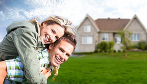 Couple in front of the house