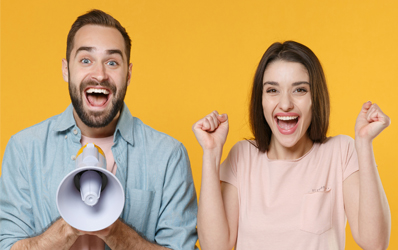 Woman and Man excited with a megaphone