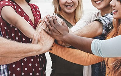 A group of people holding hands