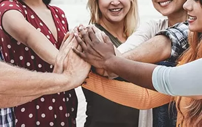 A group of people holding hands